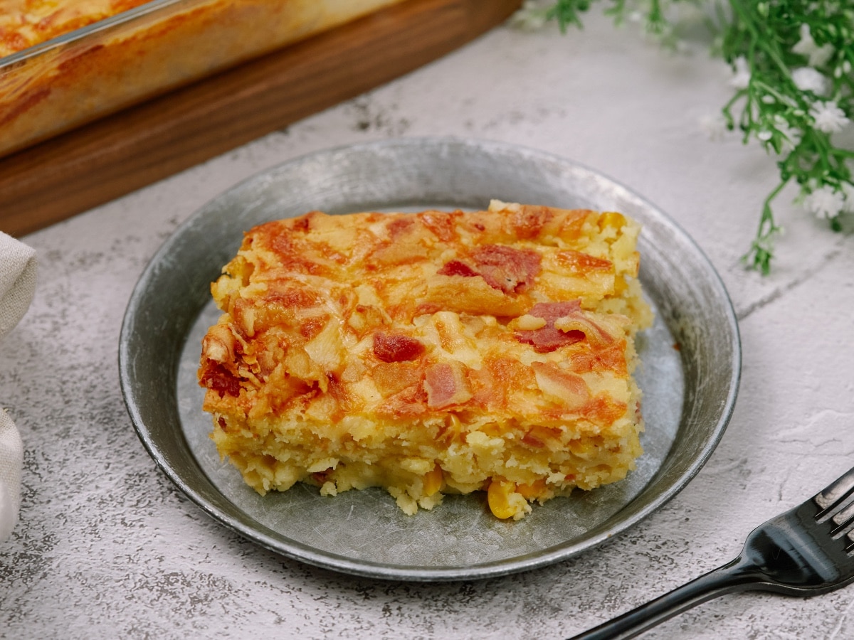 a square piece of cornbread casserole on a small plate