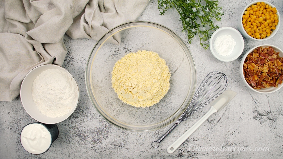 a large glass bowl filled with corn meal