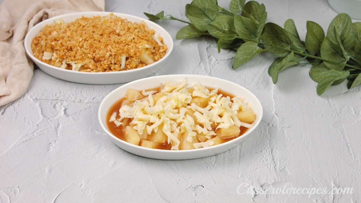 cheese topping the pineapple mixture in a small white bowl