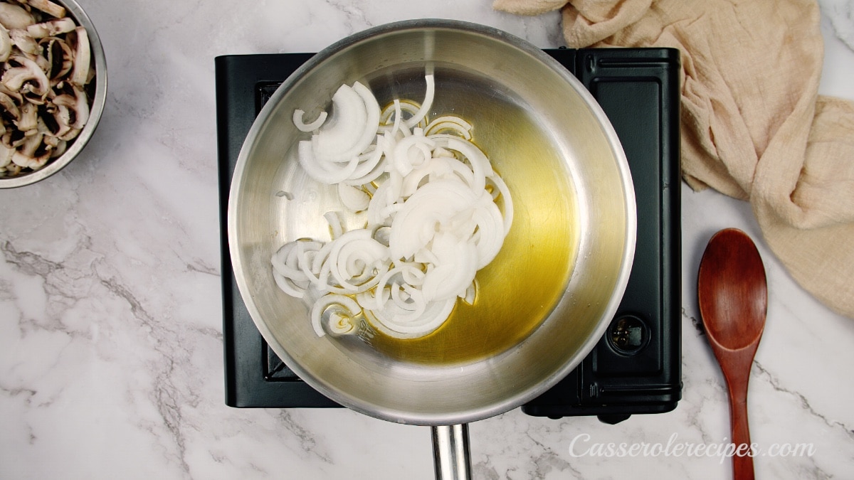 sliced onions and oil in a saute pan