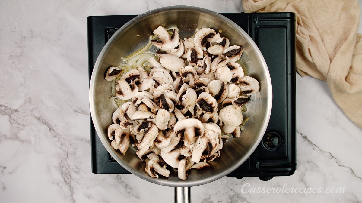 sliced mushrooms in a saute pan