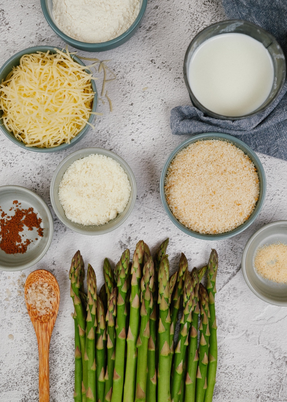 ingredients for asparagus casserole in small bowls