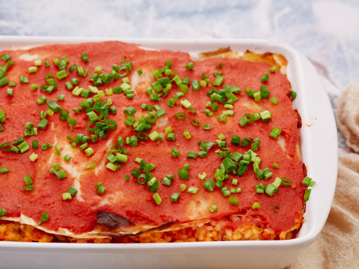 cabbage rolls casserole in a white baking dish
