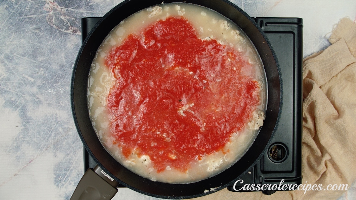 tomato sauce added to skillet