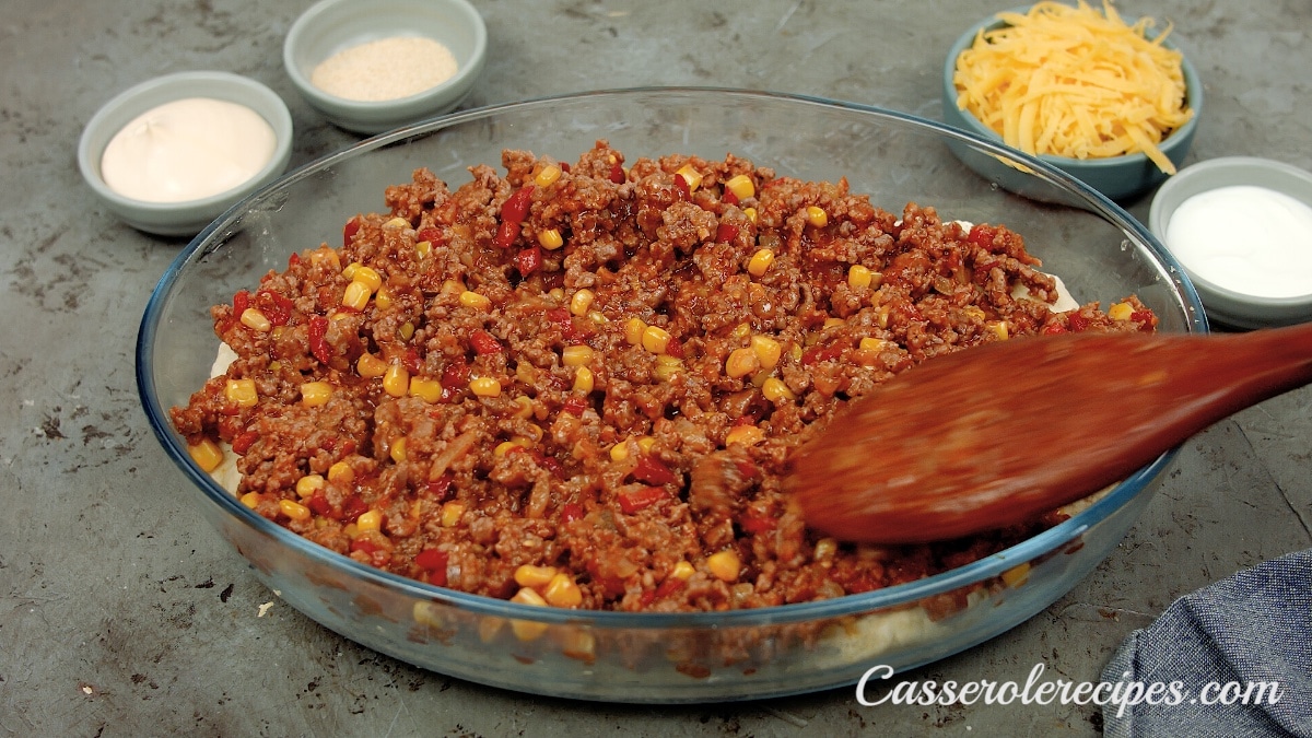 ground beef mixture spread in a baking dish