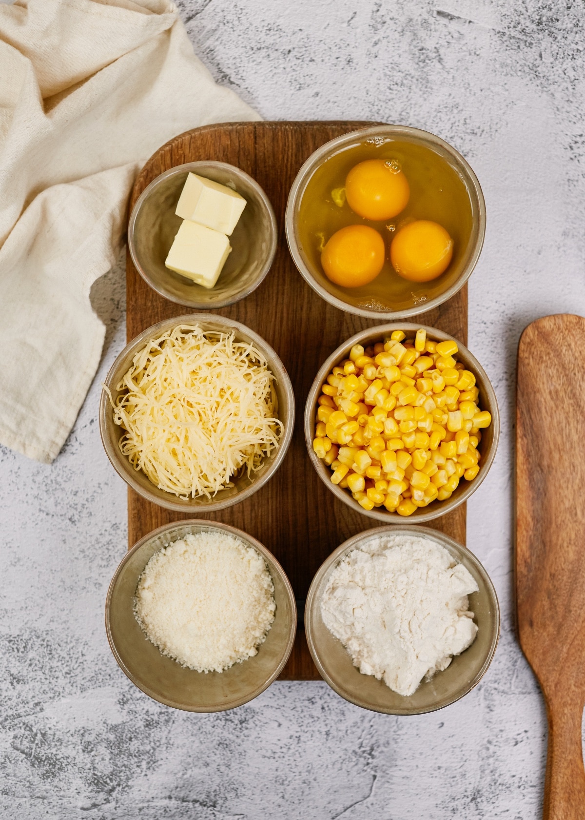 ingredients in small bowls for corn casserole