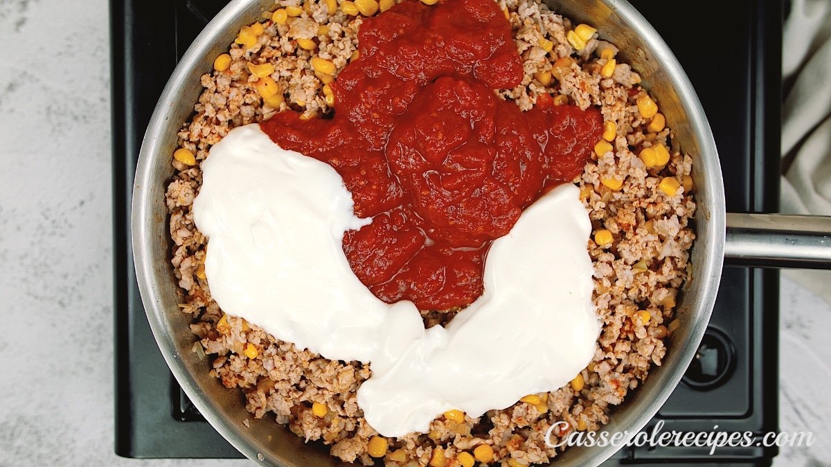 sour cream and tomato sauce in pan