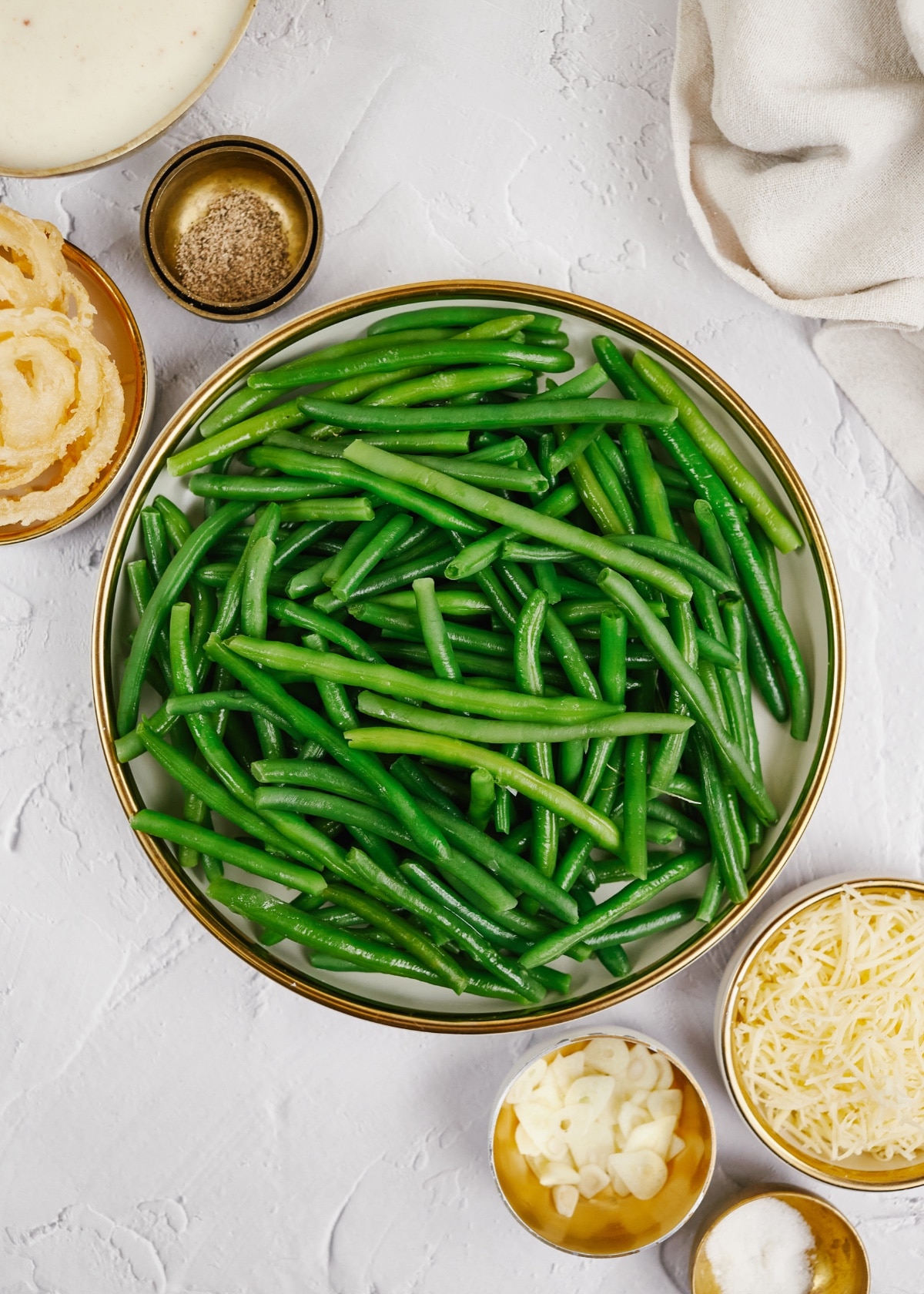 ingredients for green bean casserole in small bowls