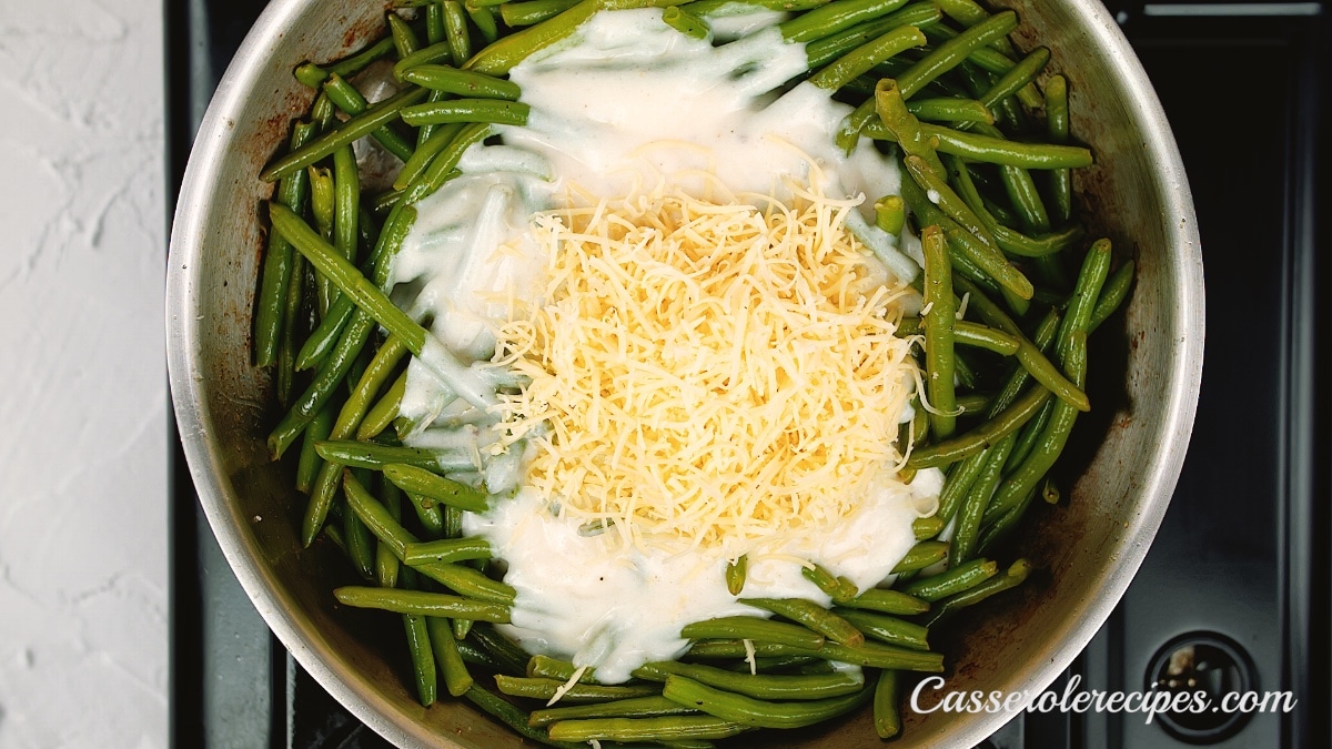 cheese topping the sauce and green beans