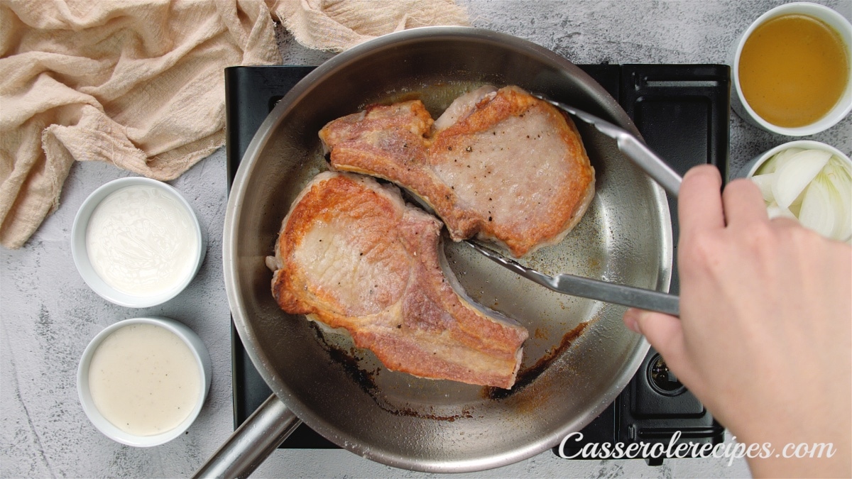 fried pork chops in a skillet