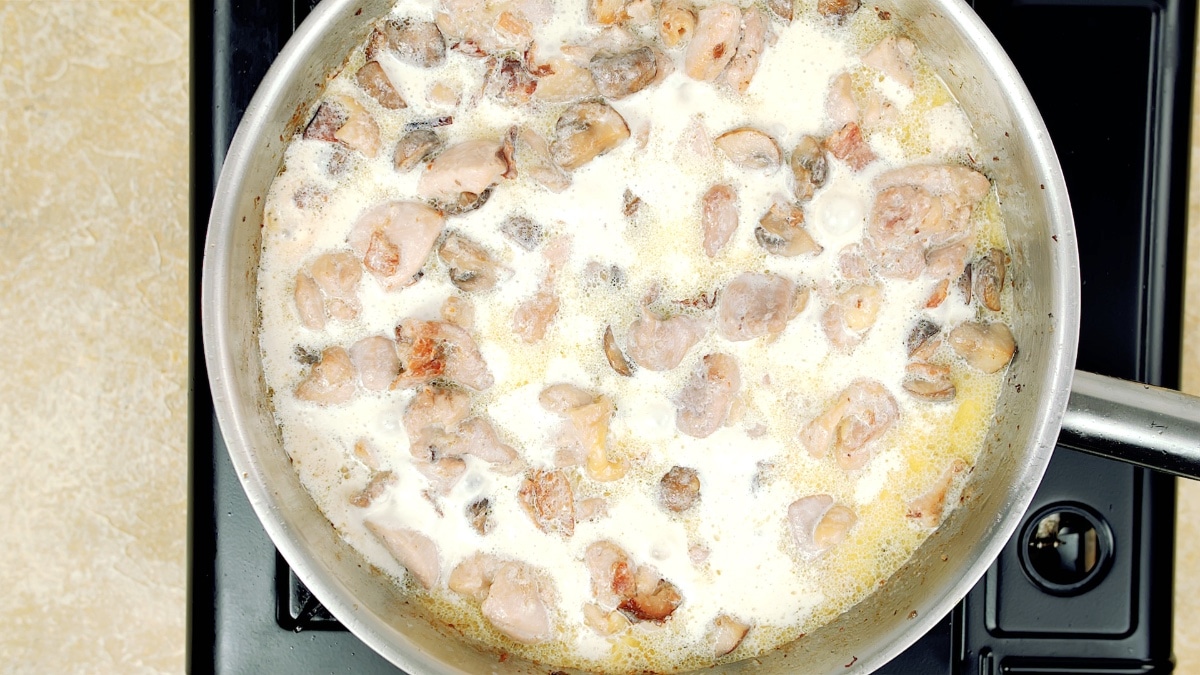 cream added to the pan with chicken, mushrooms, and bacon