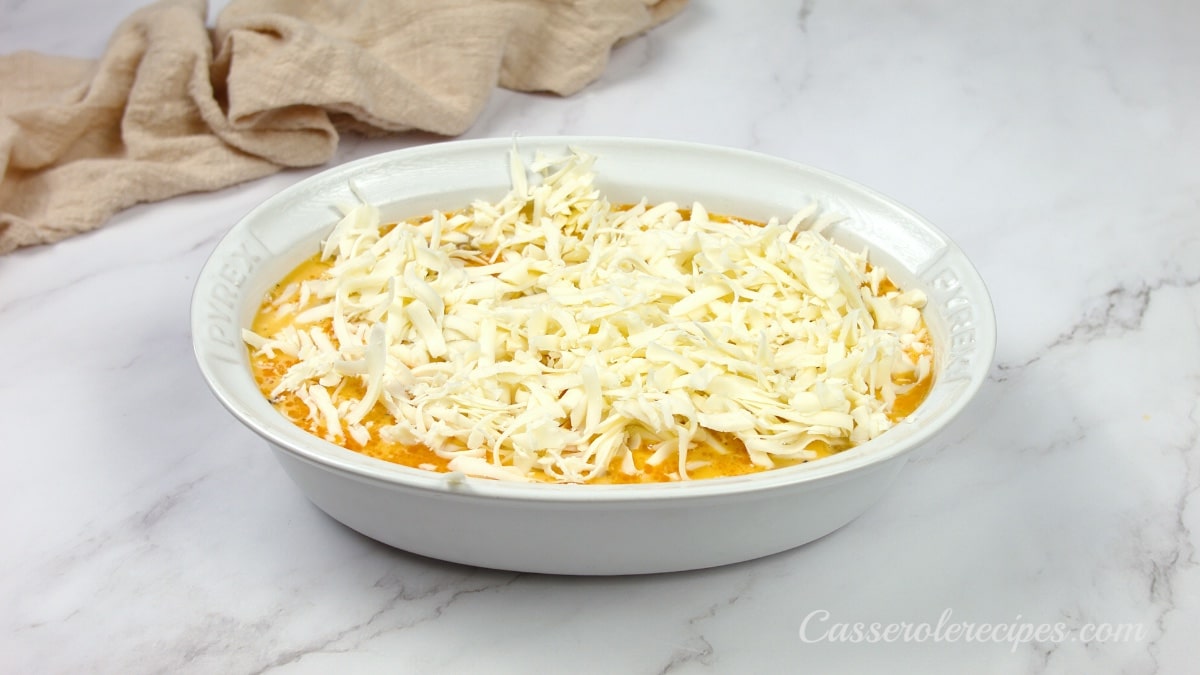 cheese topping the casserole in a baking dish