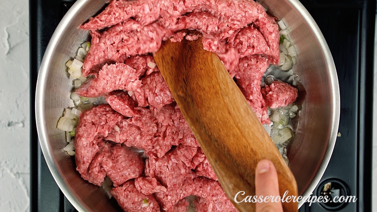 breaking up the ground beef in the pan