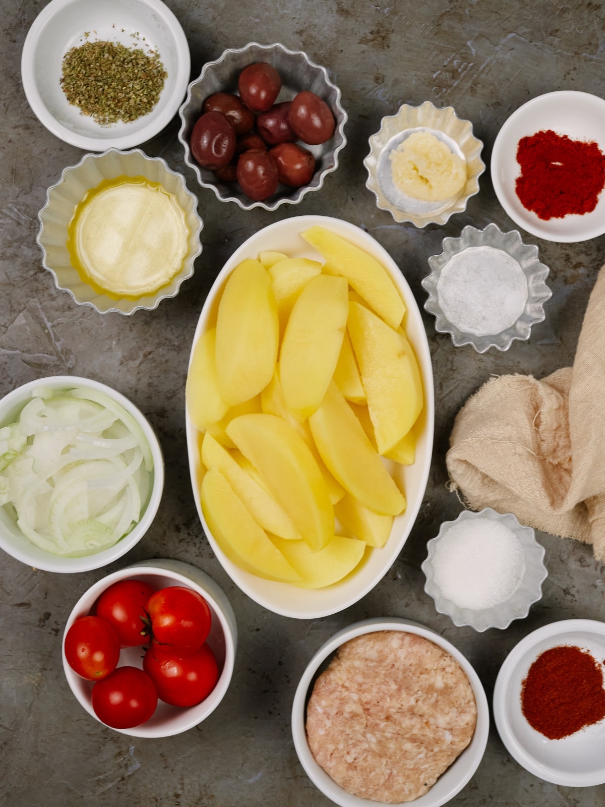 ingredients in small bowls for Turkish potato casserole