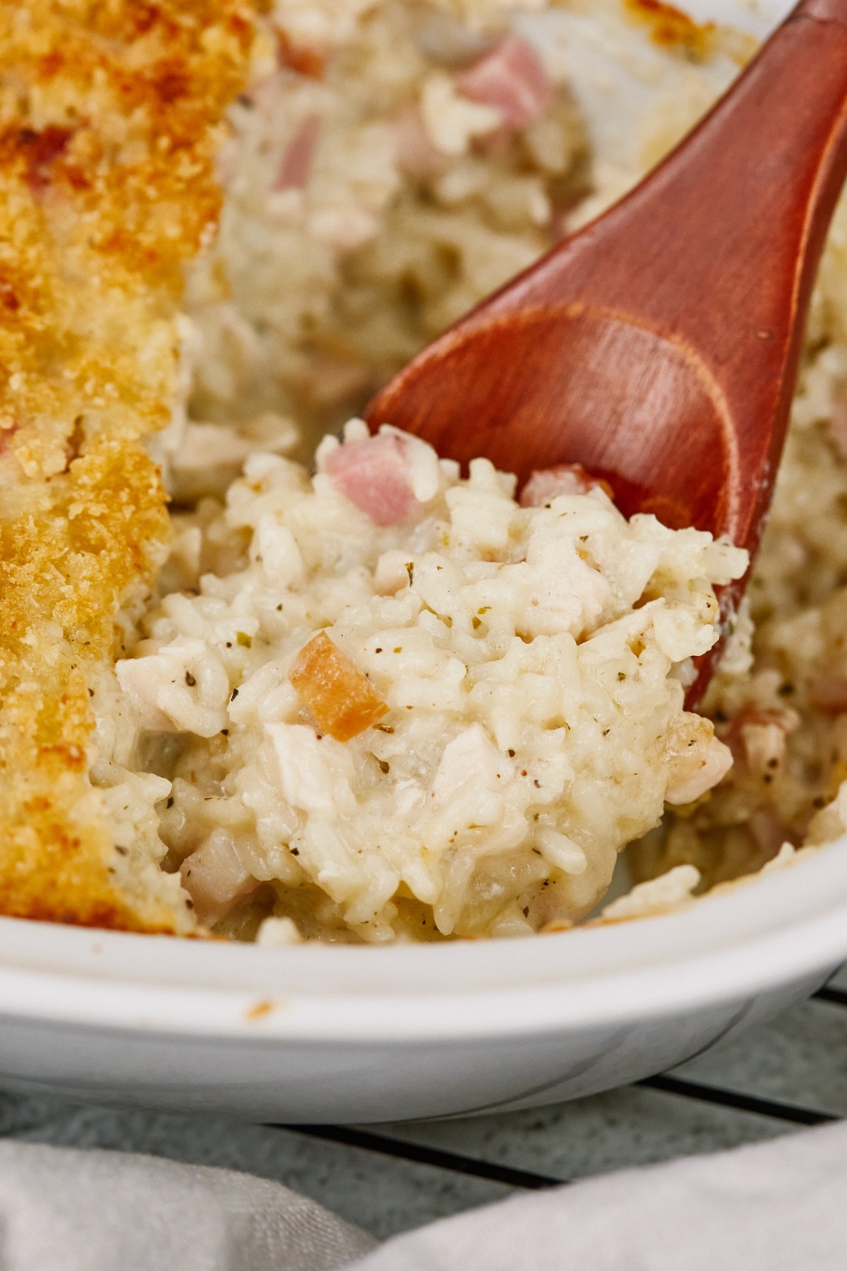 lifting chicken and rice casserole with a spoon