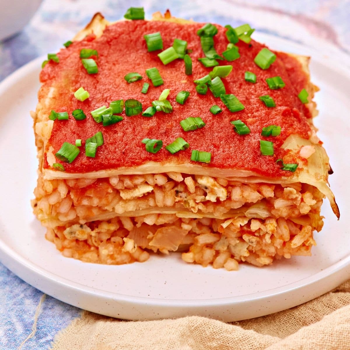 Cabbage rolls casserole served on a white plate.