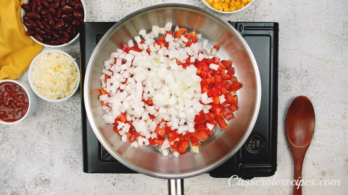 onions and red peppers in a pan