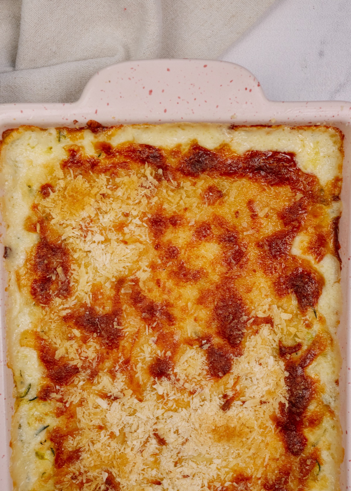 creamy squash casserole in a baking dish