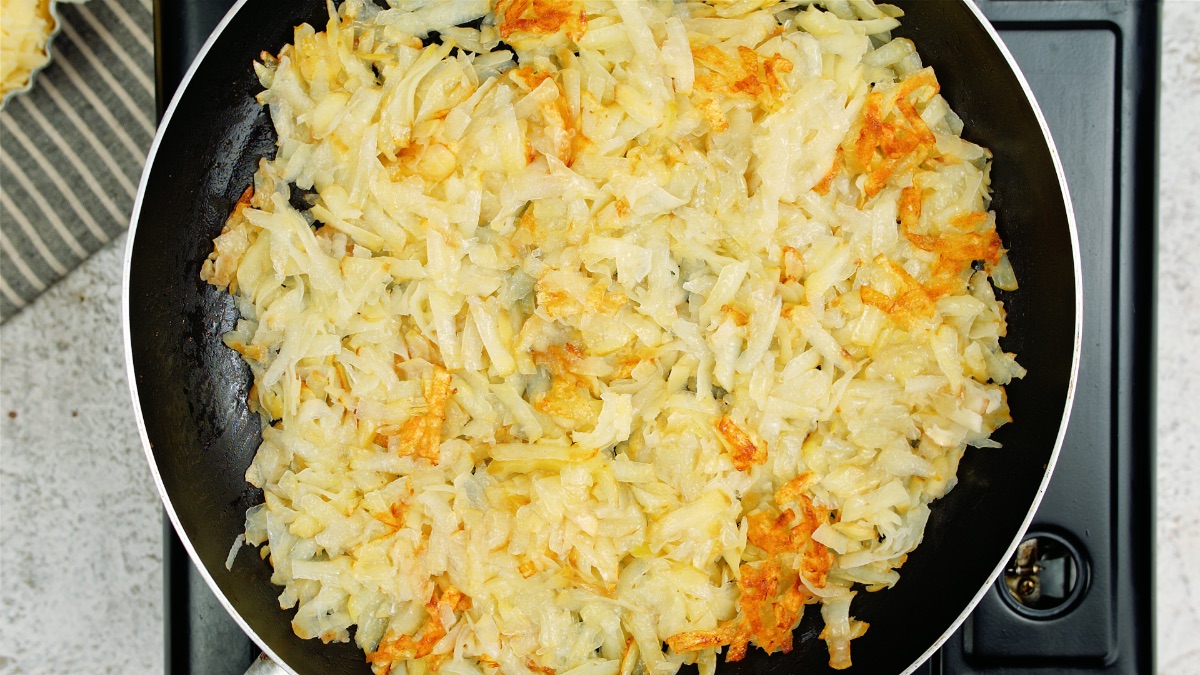 cooking hashbrowns in a pan