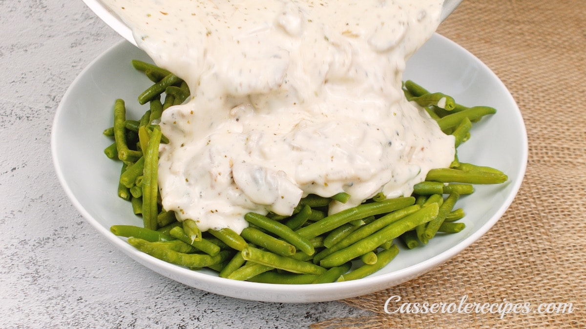 creamy sauce poured over green beans