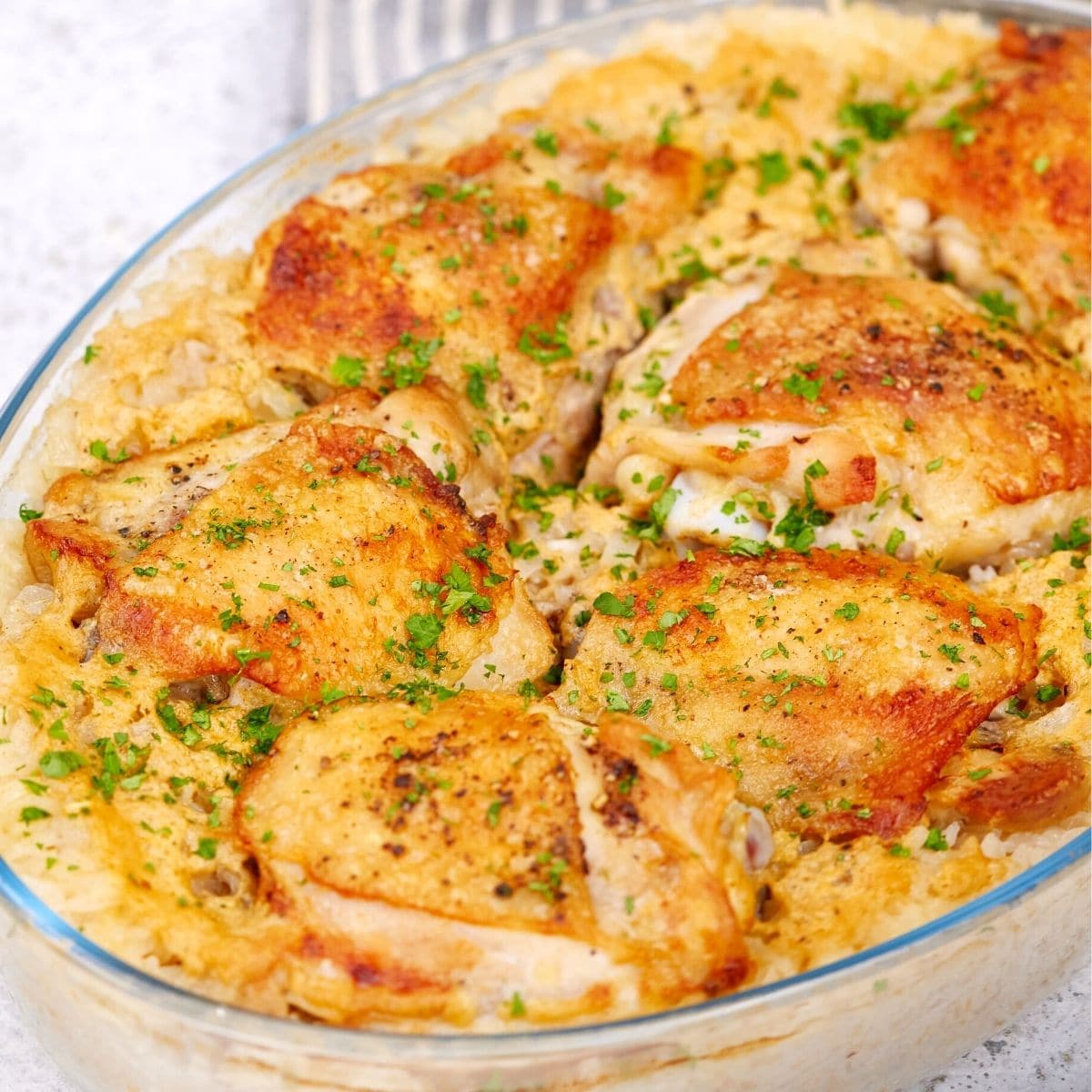 Baked chicken coconut and rice casserole in a glass dish.