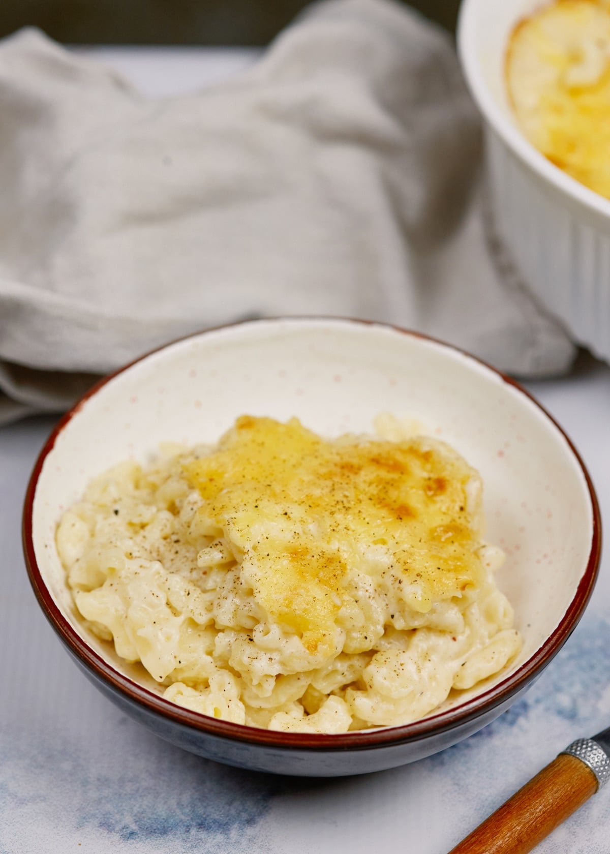 baked macaroni and cheese casserole in a white bowl