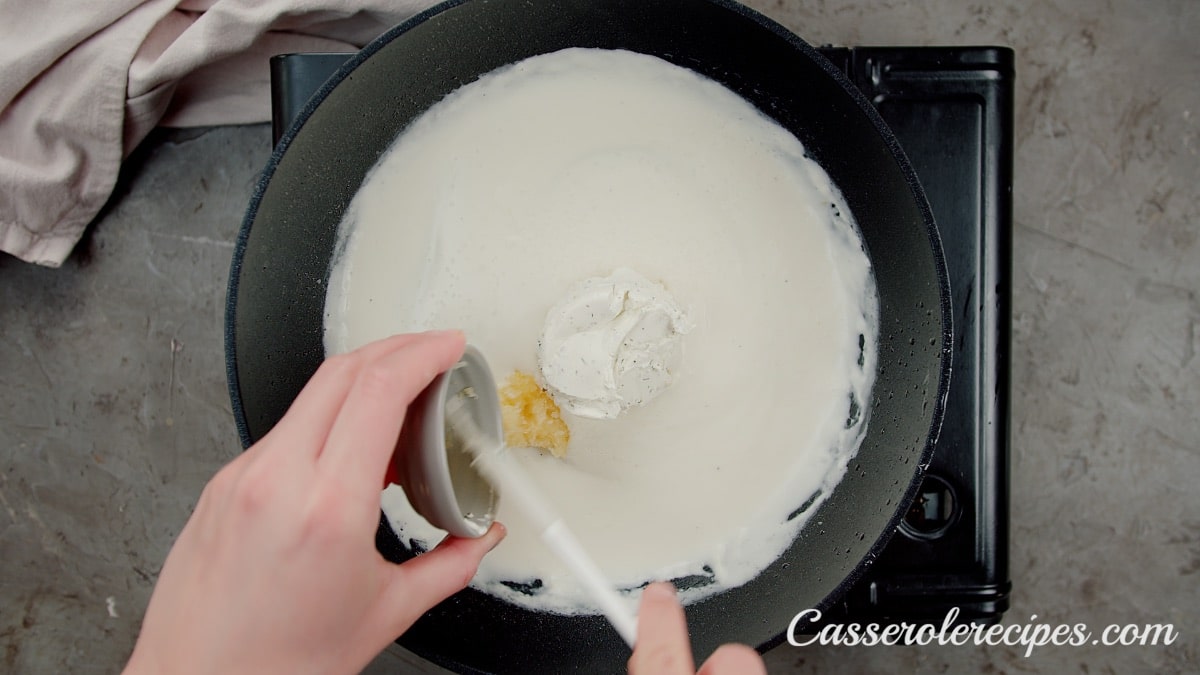 pouring garlic into milk mixture