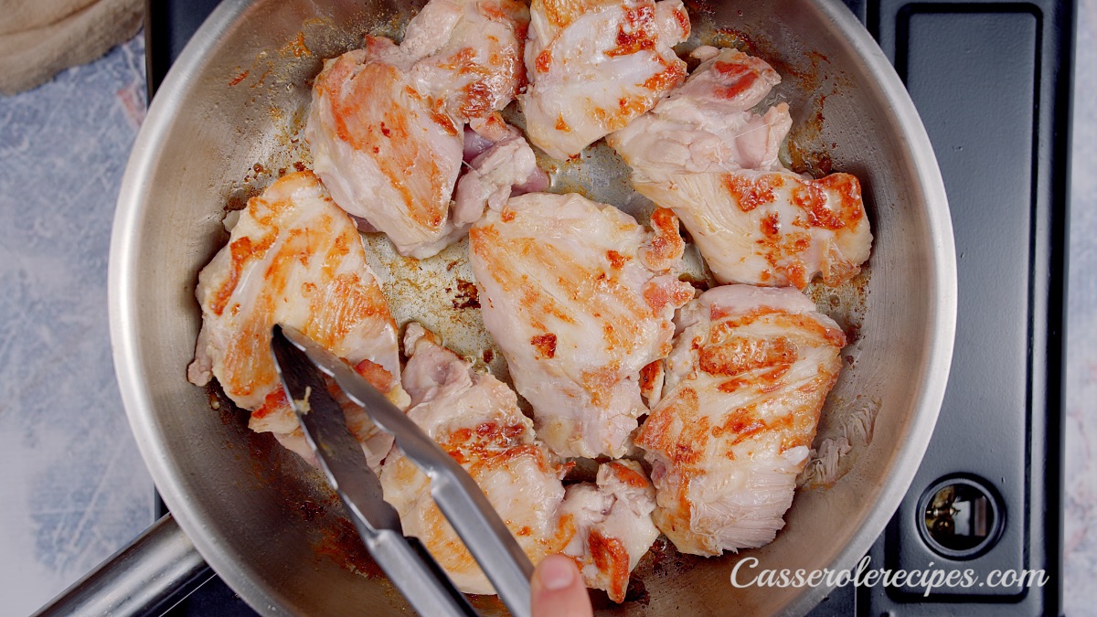 chicken flipped over in a saute pan