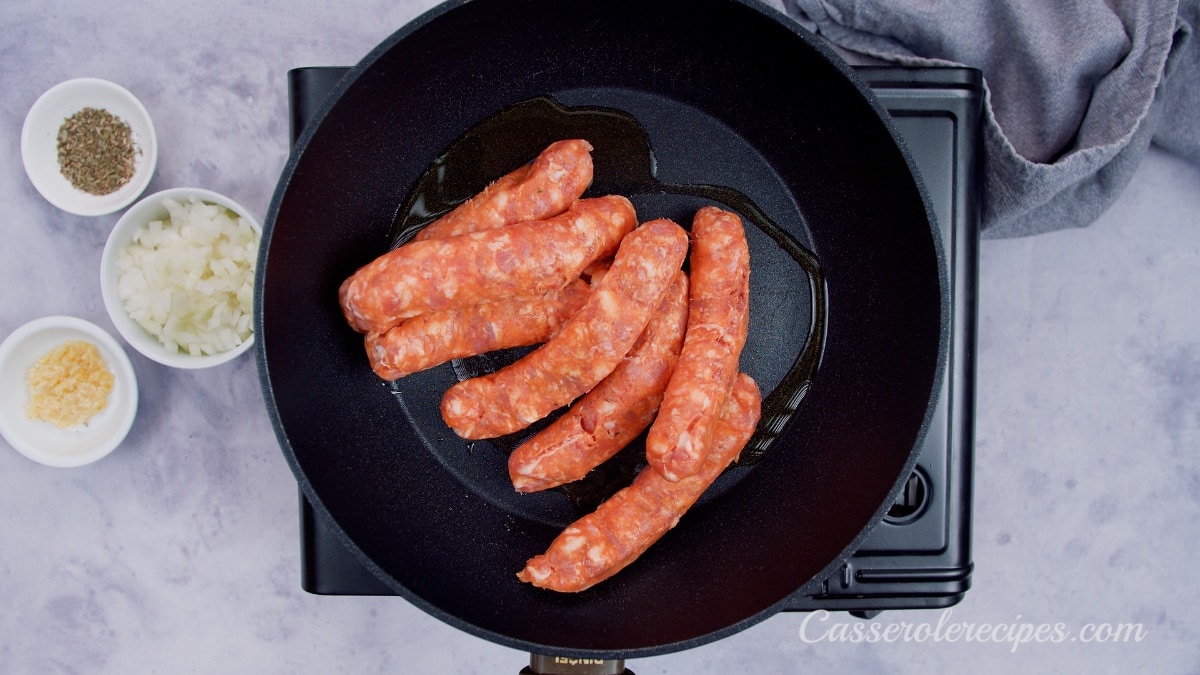 chorizo sausages in a saute pan