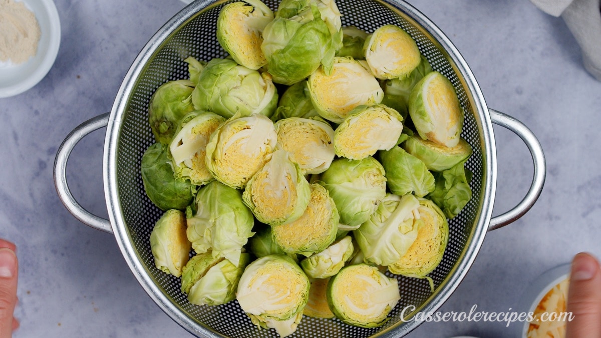 halved brussel sprouts in a metal bowl