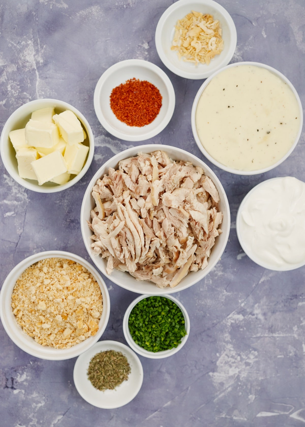 ingredients for creamy ritz chicken casserole in small white bowls