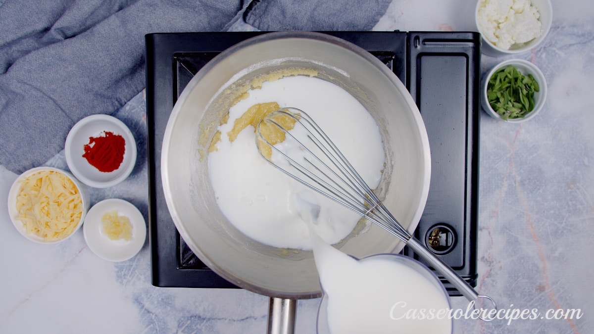 whisking cream, butter, and flour in a pot