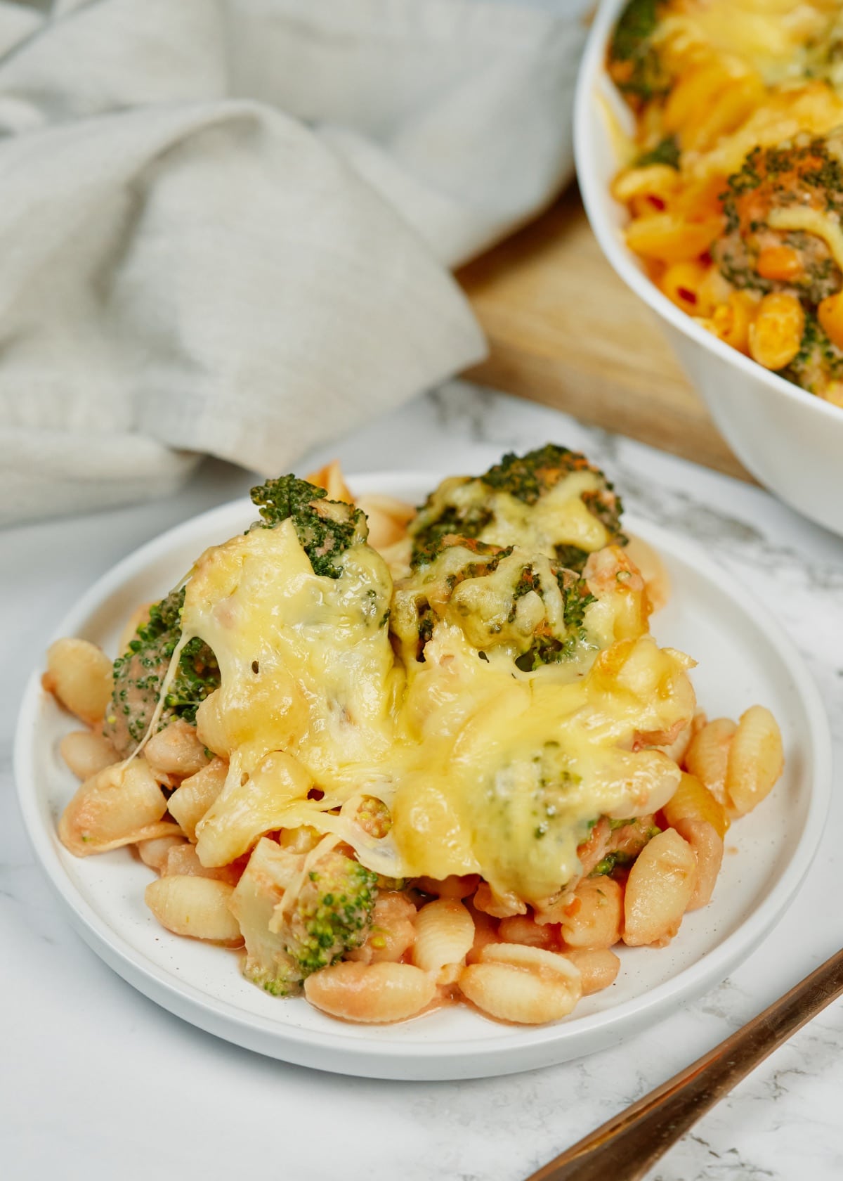 vegetarian baked gnocchi bean casserole on a white plate with a fork on the side