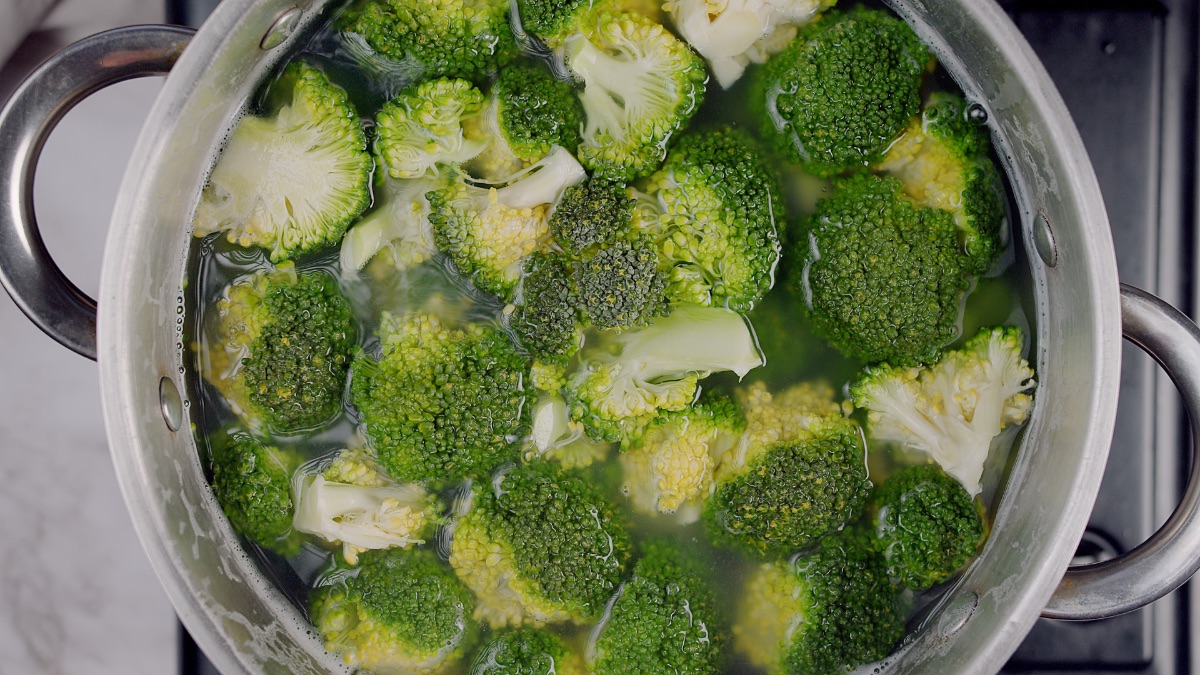 broccoli simmering in a pot of water
