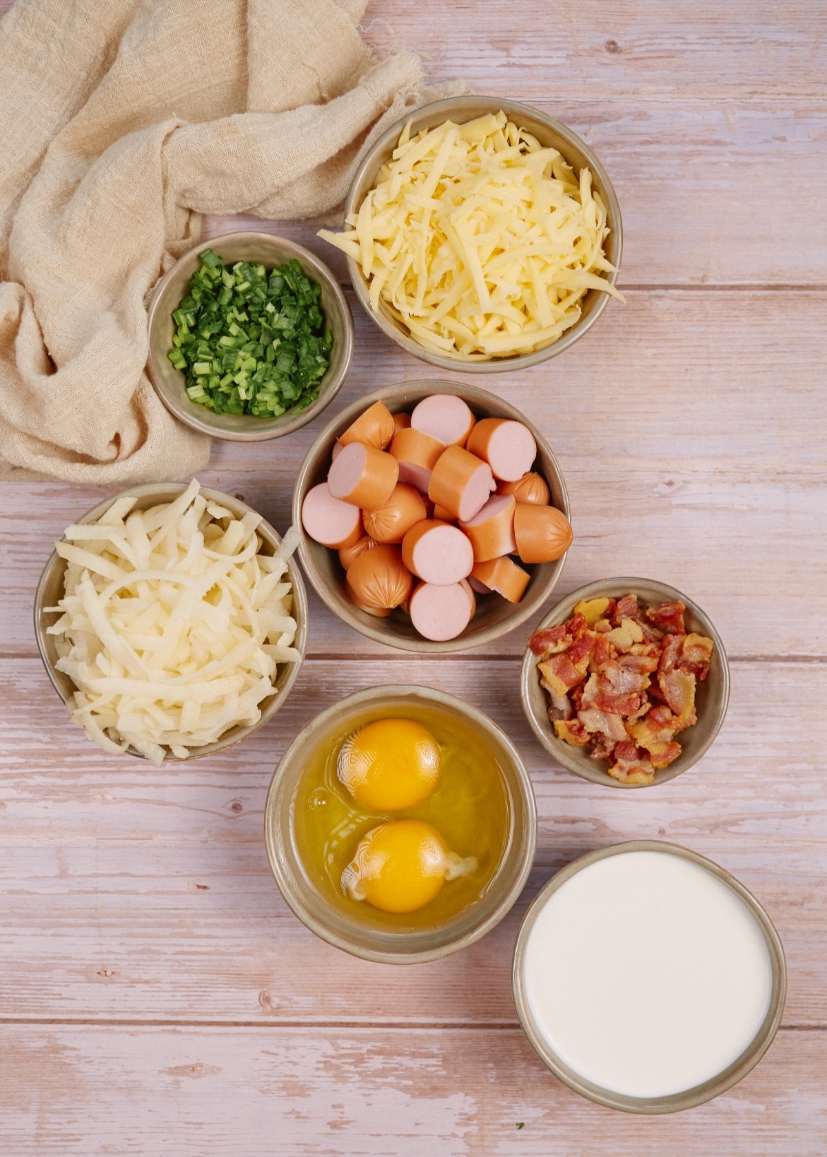 ingredients for hot dog breakfast casserole in small bowls