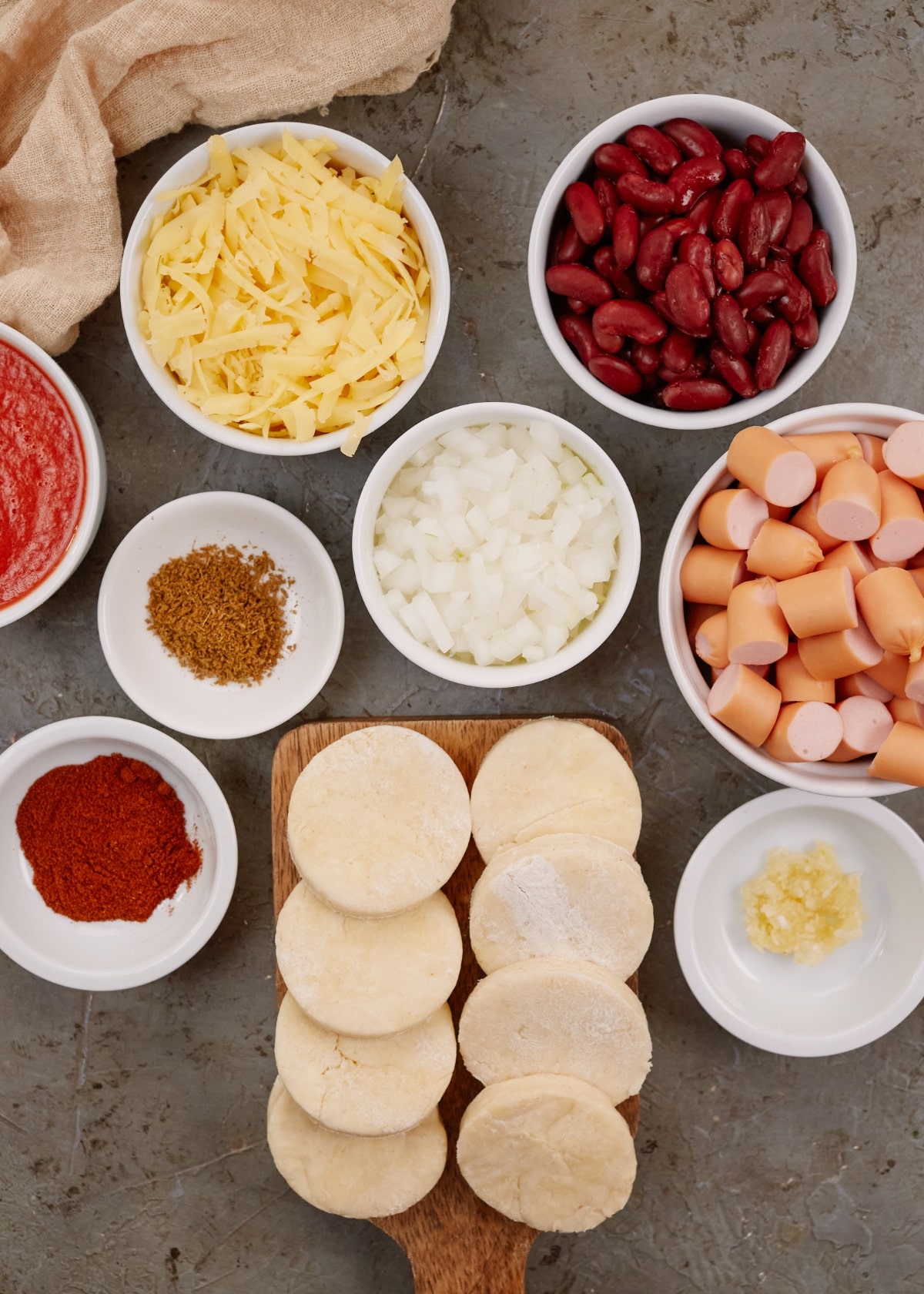ingredients for Mexican biscuit casserole in small bowls