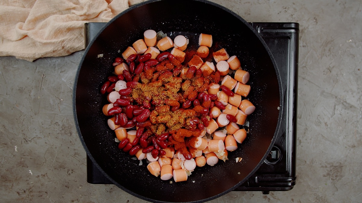 spices added to beans and hot dogs