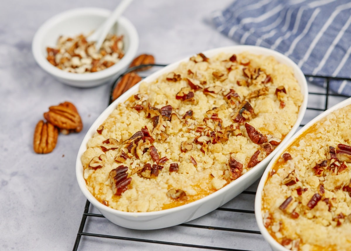 southern sweet potato casserole in two baking dishes on a cooling rack