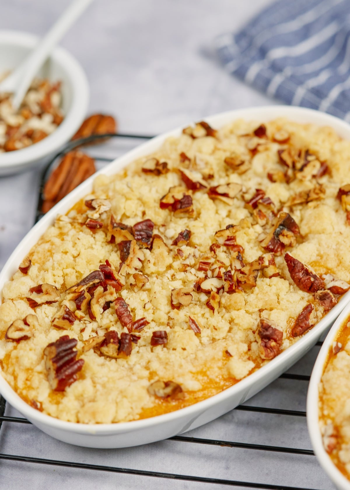 southern sweet potato casserole in two baking dishes on a cooling rack