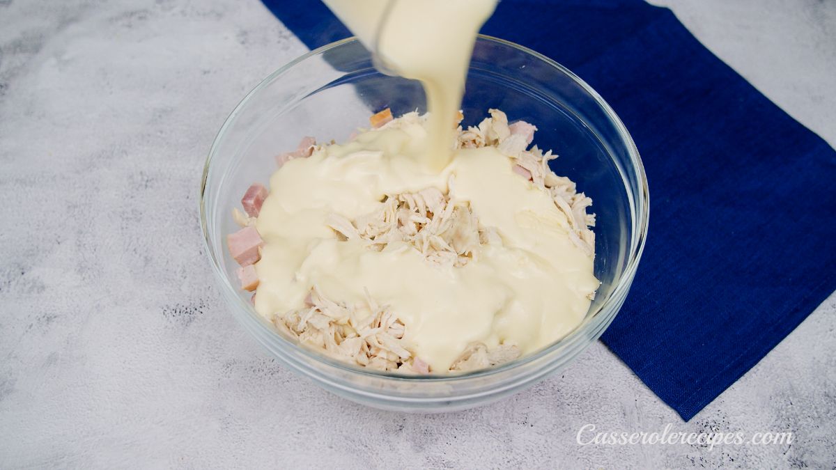 sauce being poured over ham in glass bowl