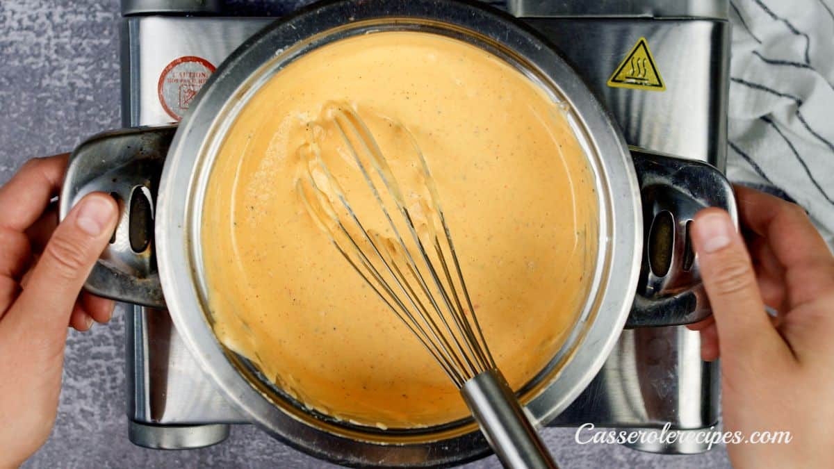 creamy yellow sauce in stockpot on hot plate