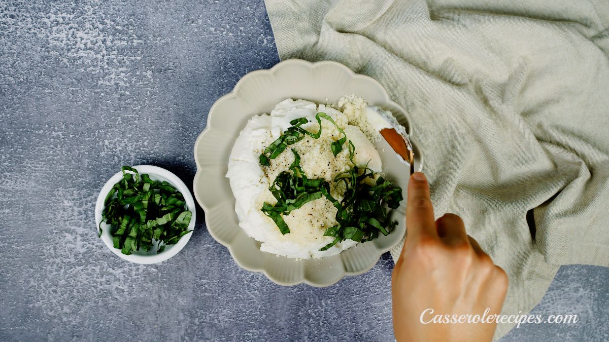 cream bowl of cheese and herbs