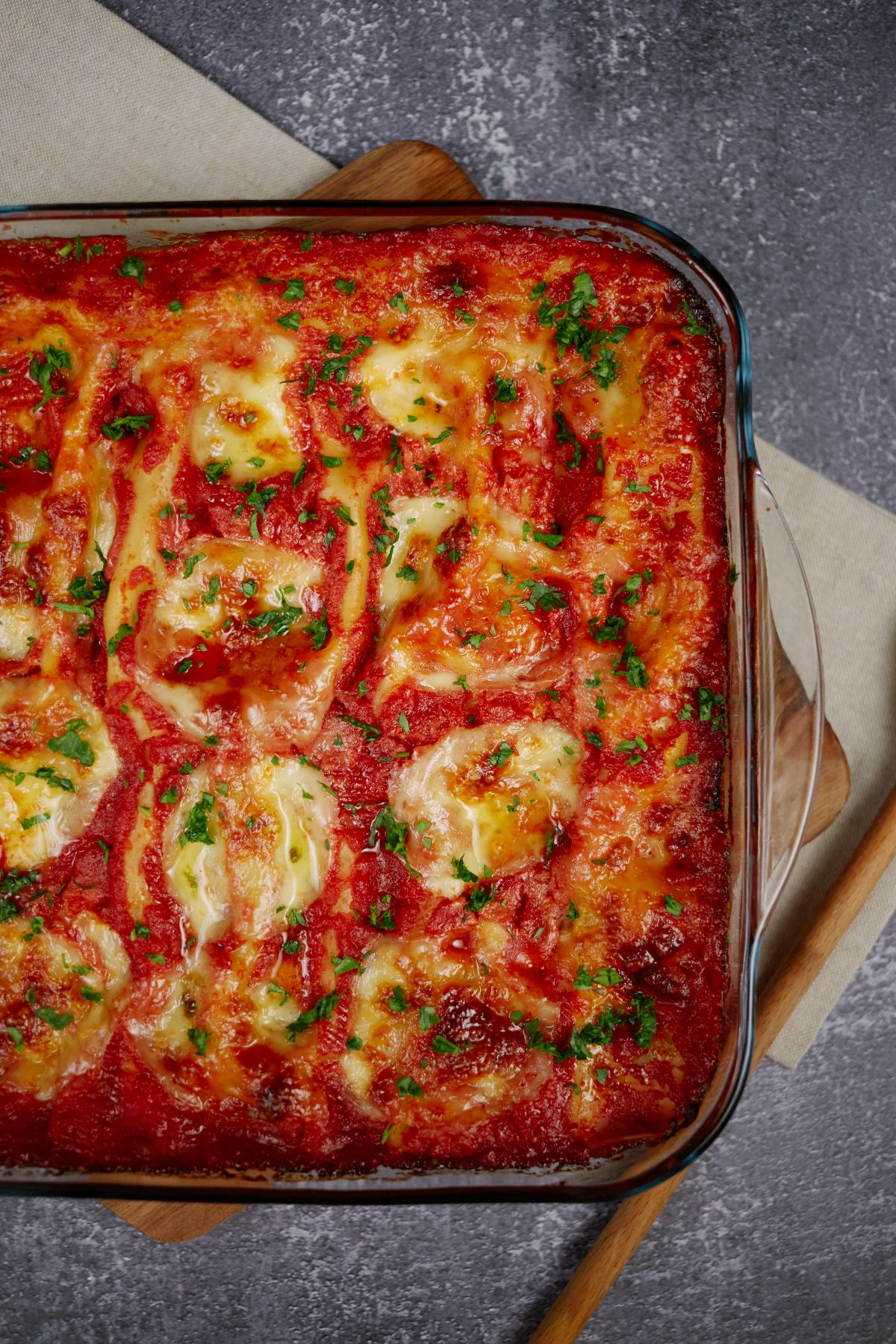 image looking down at baked stuffed pasta in casserole dish