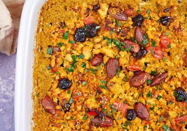 white baking dish of quinoa casserole topped with almonds