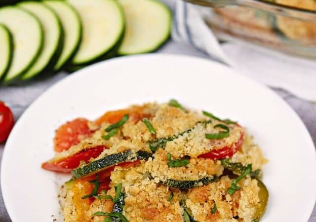 white bowl of tomato and zucchini casserole