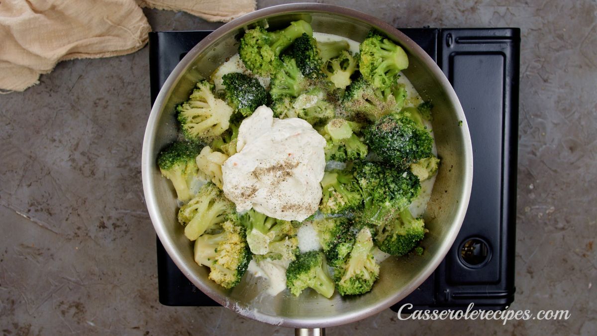 cheese on top of broccoli in skillet