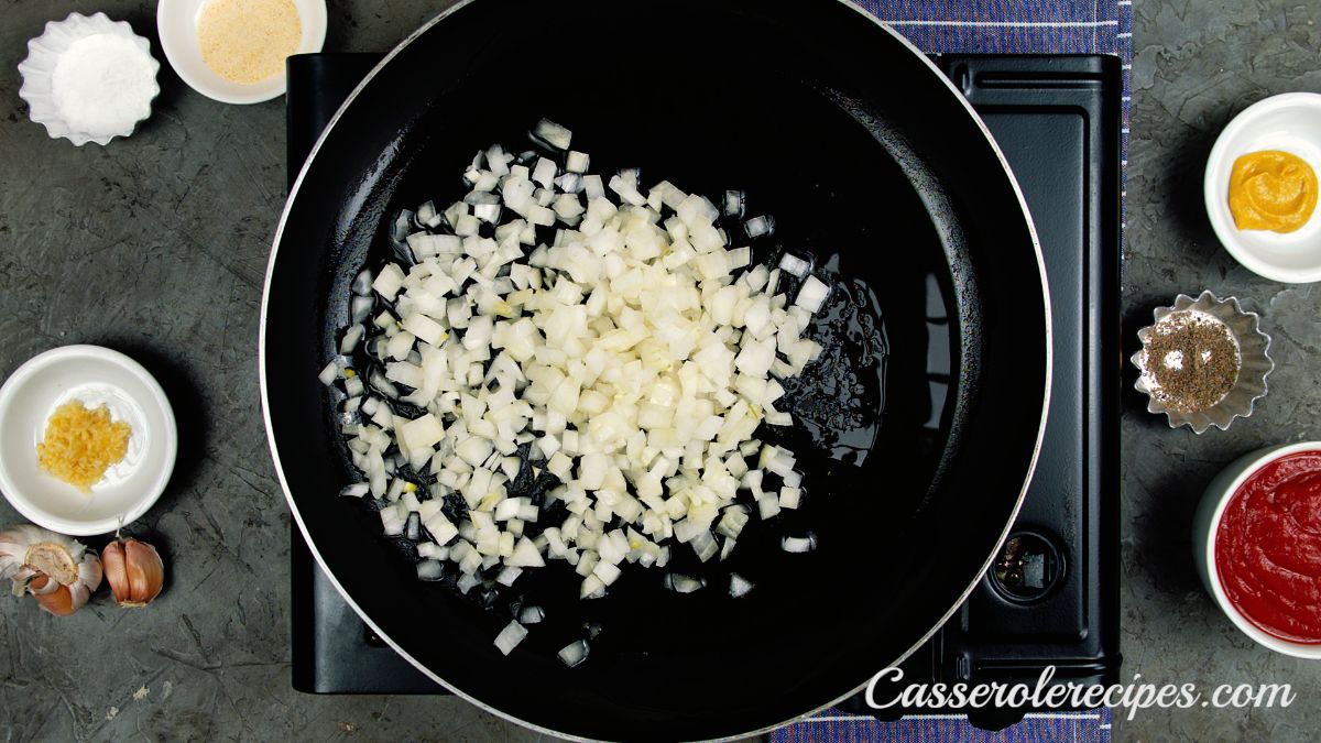 black skillet with white onions