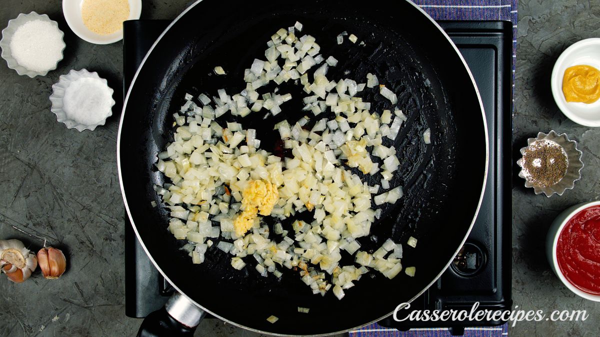 minced garlic in skillet with cooked onions