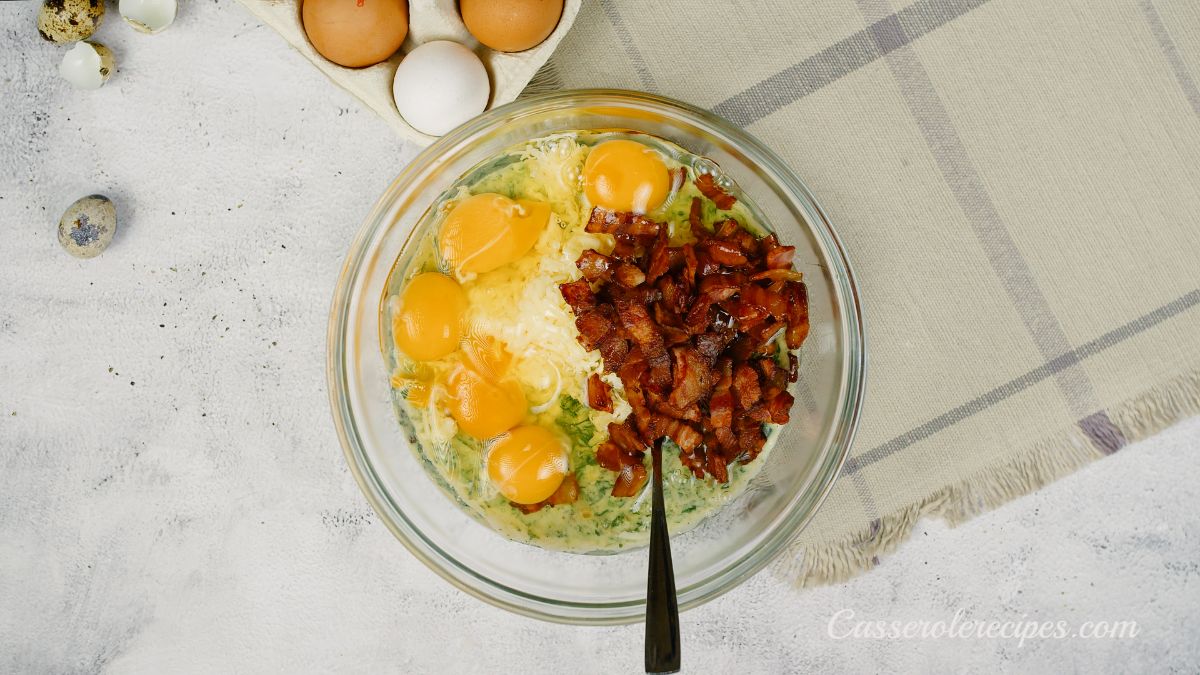 glass bowl of eggs bacon and spinach