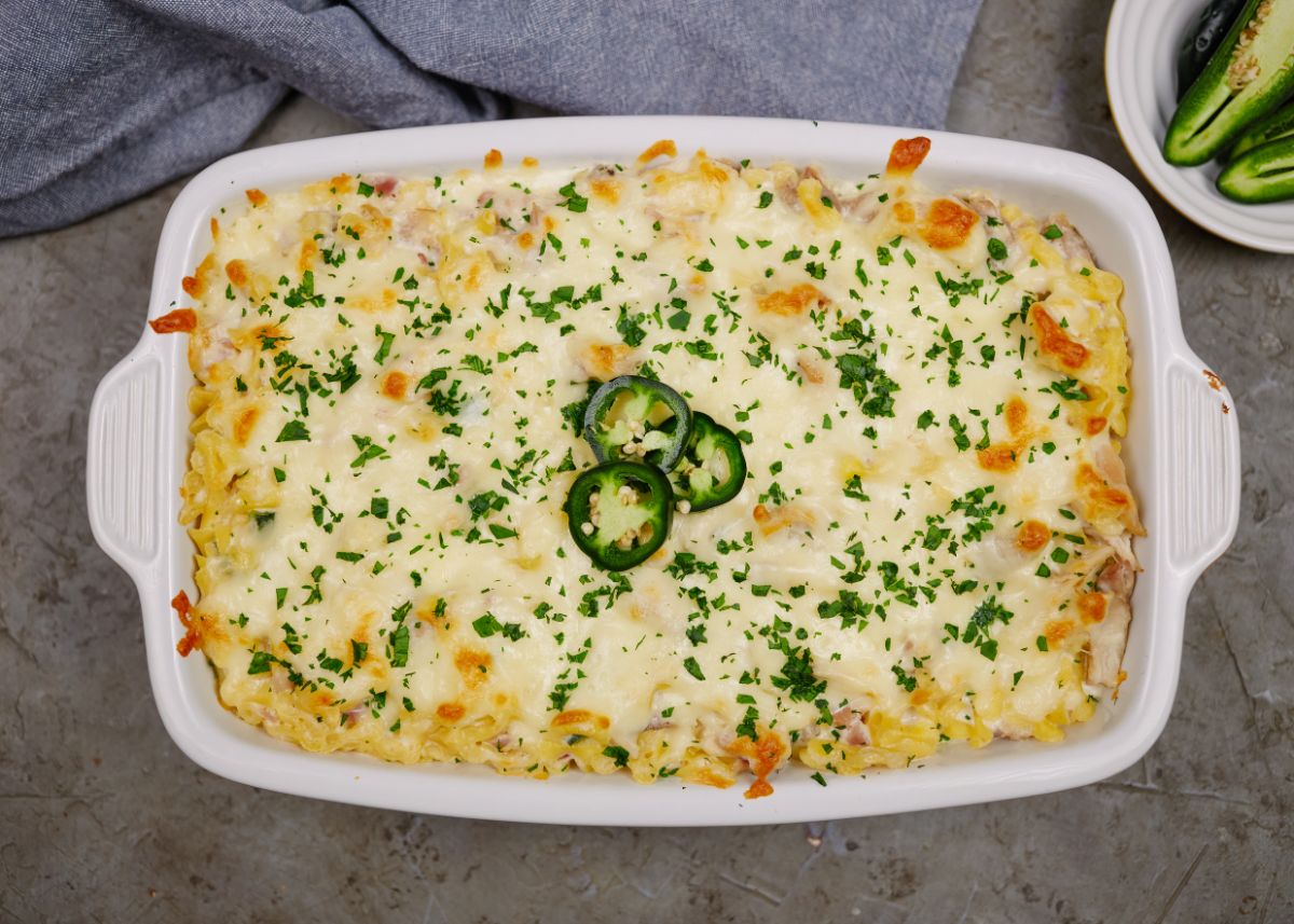 image looking down on white baking dish filled with jalapeno popper casserole sitting on gray table